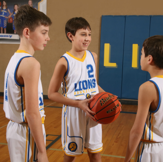 Three kids ready to play basket ball